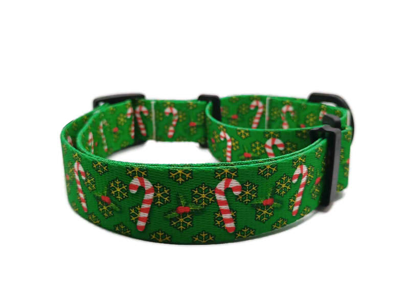 Festive red and white candy canes on a christmas green background with yellow-golden snowflakes. This collar features plastic hardware, which is ideal for dogs allergic to metal or service dogs going thru TSA checkpoints.