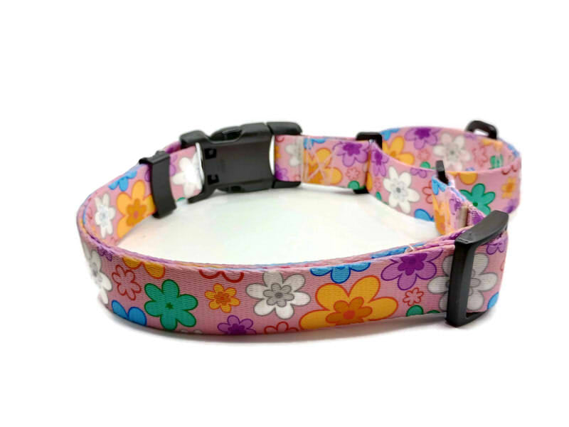 This image displays a beautiful colorful pansies on a baby pink background. Unlike our typical metal free TSA martingales, this collar features a quick release buckle in a martingale style for easy on and off! Take the hassle out of adjusting to put it over the head and then fitting to the pups neck. Simply unclip this collar, adjust to size and snap it on! No more adjusting for on and off.