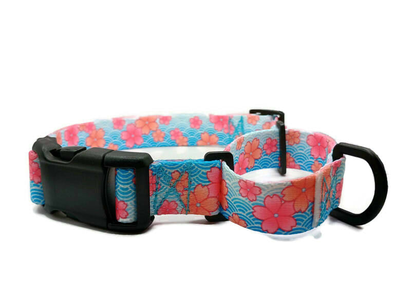 This image displays a beautiful Pink Blossom print on a spring blue background. Unlike our typical metal free TSA martingales, this collar features a quick release buckle in a martingale style for easy on and off! Take the hassle out of adjusting to put it over the head and then fitting to the pups neck. Simply unclip this collar, adjust to size and snap it on! No more adjusting for on and off.