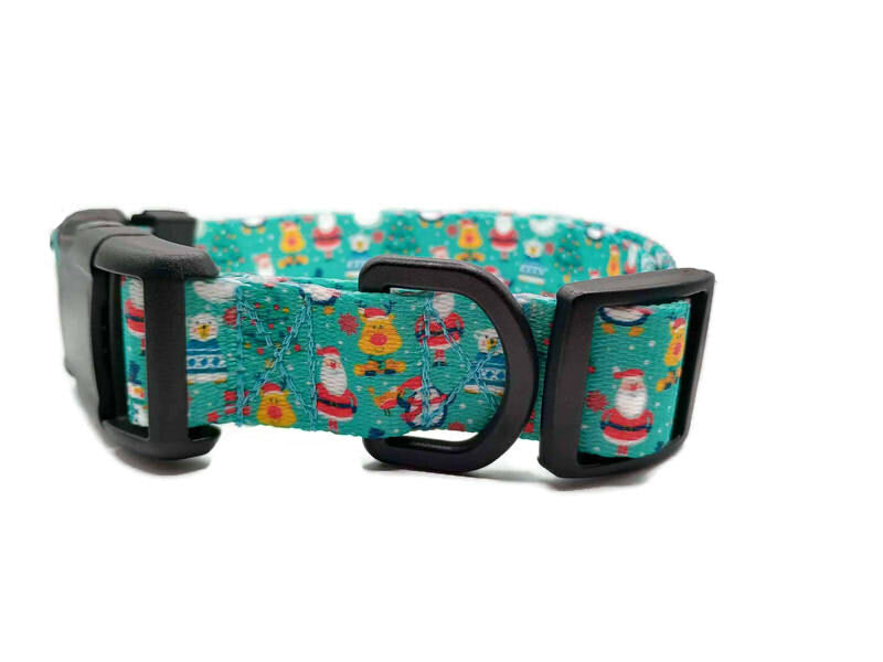 Santa and his friends; Rudolph, polar bear and penguins are celebrating Christmas on a light teal background with scattered Christmas trees. This collar features plastic hardware, which is ideal for dogs allergic to metal or service dogs going thru TSA checkpoints.