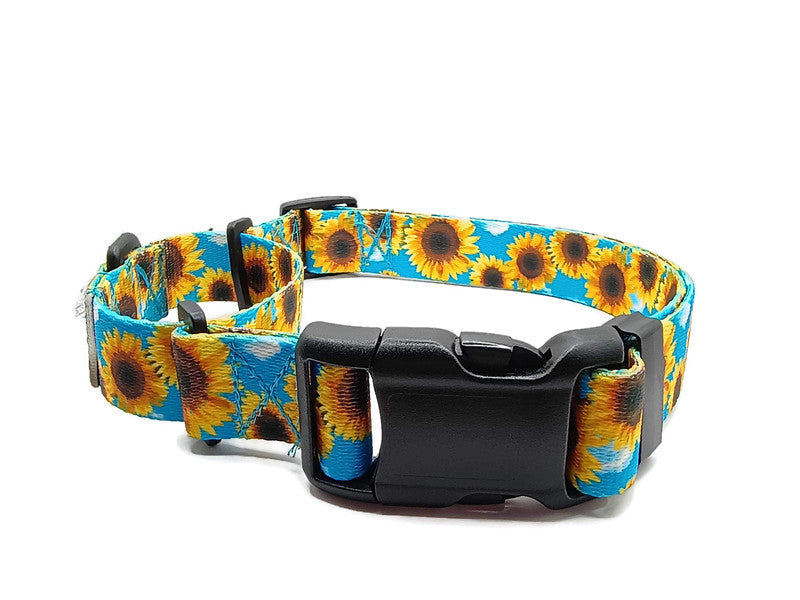 This image displays a beautiful yellow sunflowers on a sky blue background. Unlike our typical metal free TSA martingales, this collar features a quick release buckle in a martingale style for easy on and off! Take the hassle out of adjusting to put it over the head and then fitting to the pups neck. Simply unclip this collar, adjust to size and snap it on! No more adjusting for on and off.