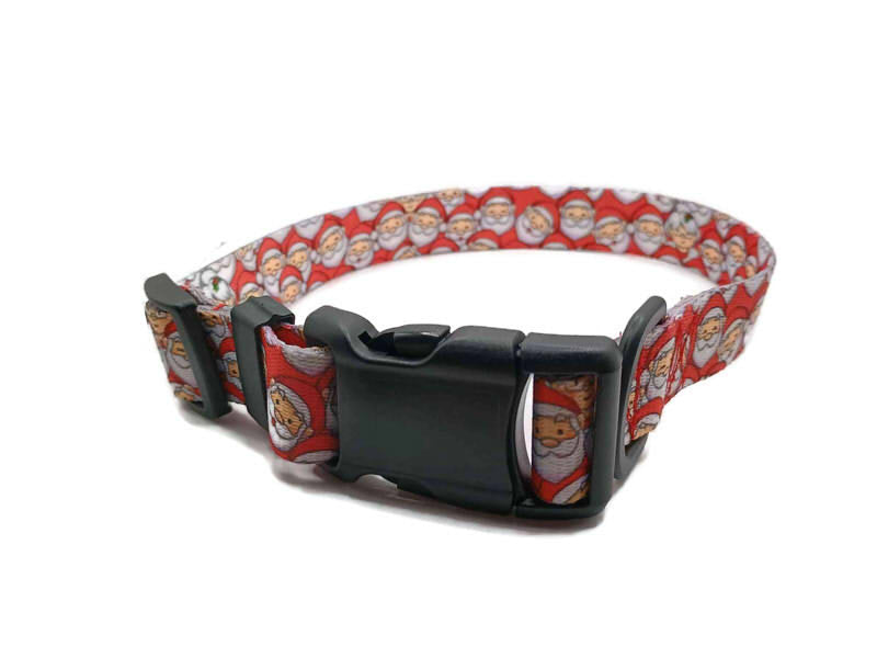 Santa Claus with Mrs Claus hidden in the Santa's the background with a red background. This collar features plastic hardware, which is ideal for dogs allergic to metal or service dogs going thru TSA checkpoints.