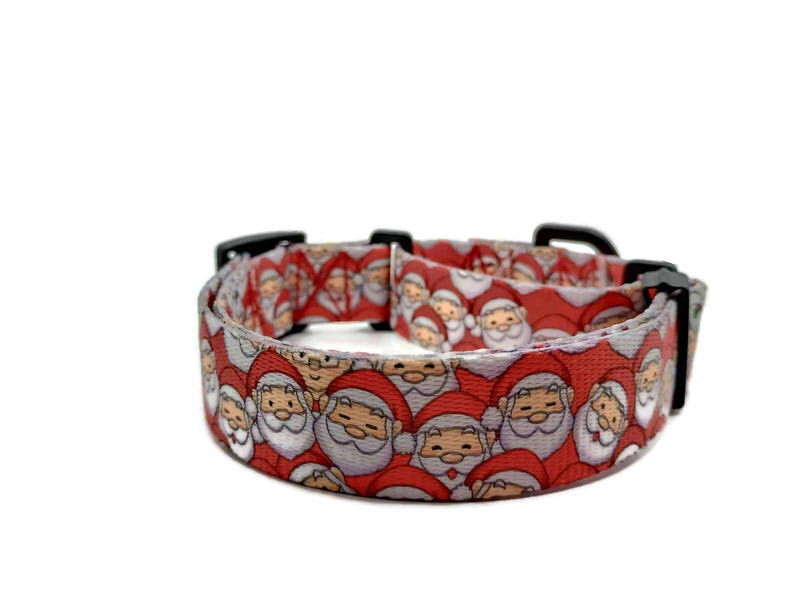 Santa Claus with Mrs Claus hidden in the background with a red background. This collar features plastic hardware, which is ideal for dogs allergic to metal or service dogs going thru TSA checkpoints.