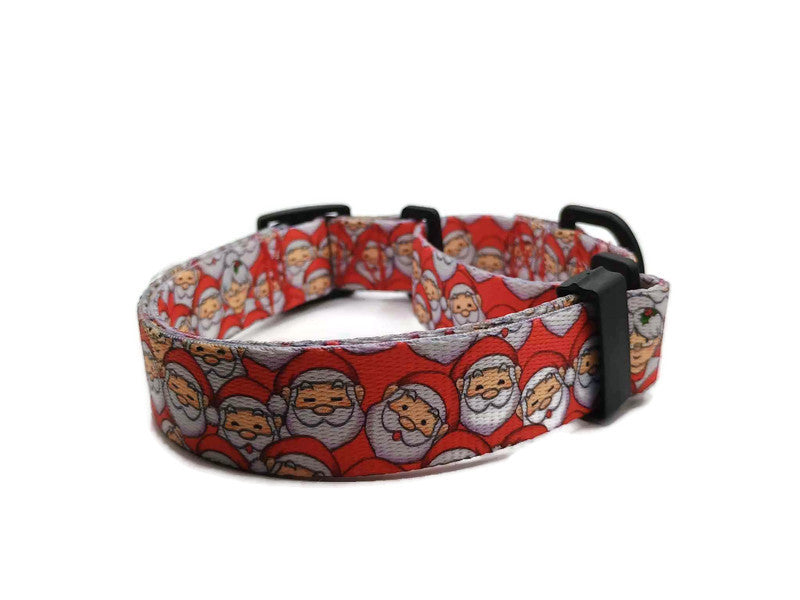 Santa Claus with Mrs Claus hidden in the background with a red background. This collar features plastic hardware, which is ideal for dogs allergic to metal or service dogs going thru TSA checkpoints.