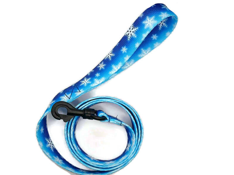 Festive fuzzy snowflakes on a cold wintery blue background. Featuring 2 leash clip styles; swivel clips or bolt snaps! Completely metal free, ideal for dogs with metal allergies or TSA checkpoints.